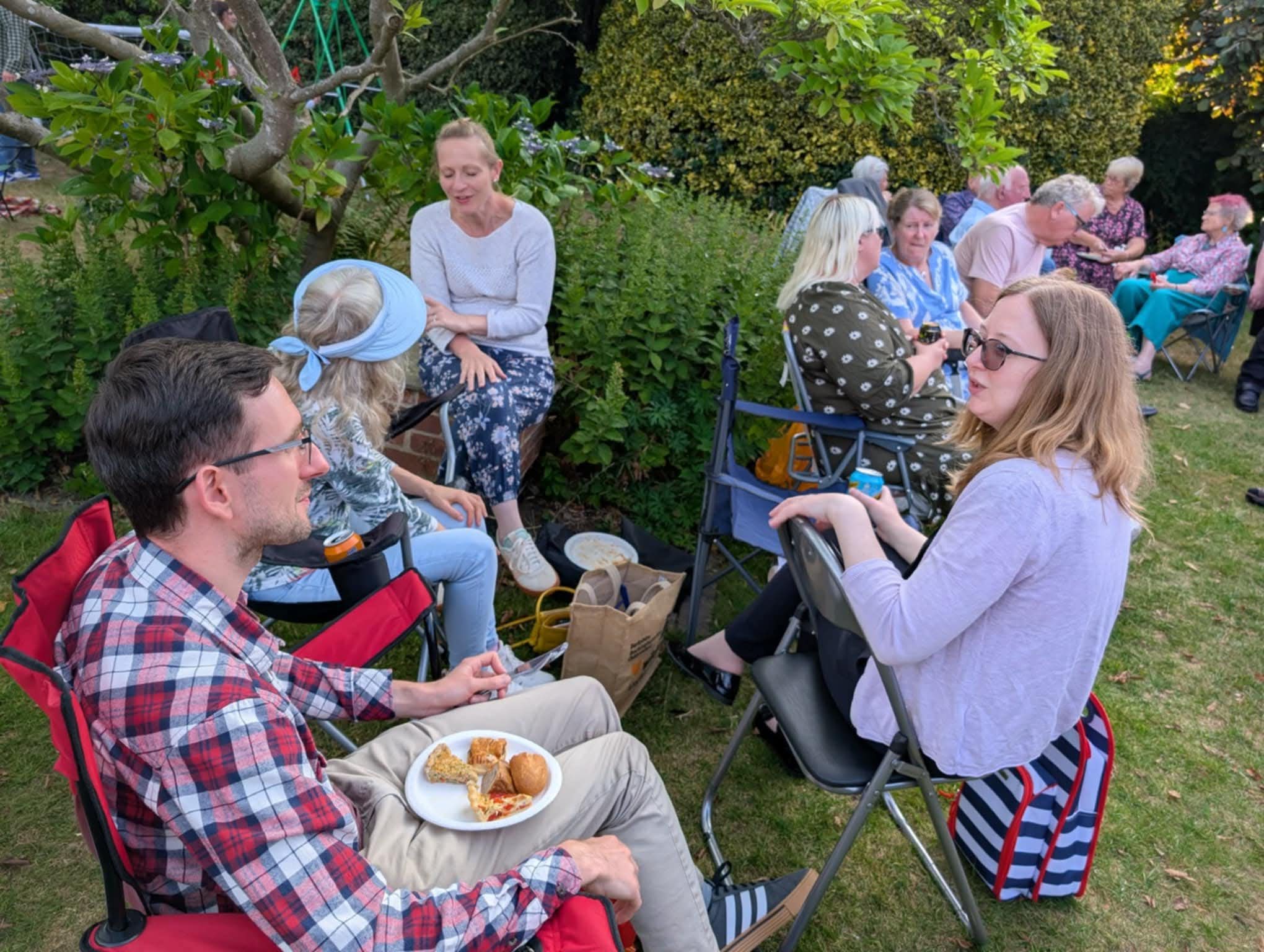 David Nickson (L) has a good plateful of party food.